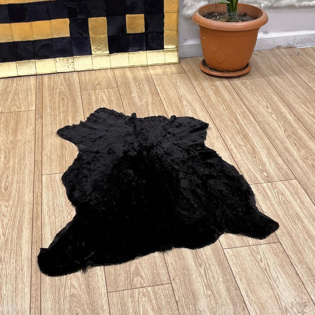 Black Sheepskin Rug: Genuine Australian Sheep Hide, Soft Fur (70x100 cm / 2.3x3.33 Ft - BuzzLeatherCarpetBlack Sheepskin Rug: Genuine Australian Sheep Hide, Soft Fur (70x100 cm / 2.3x3.33 Ft