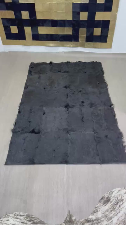 Handmade Black Patchwork Goatskin Rug: Soft, Plush Texture