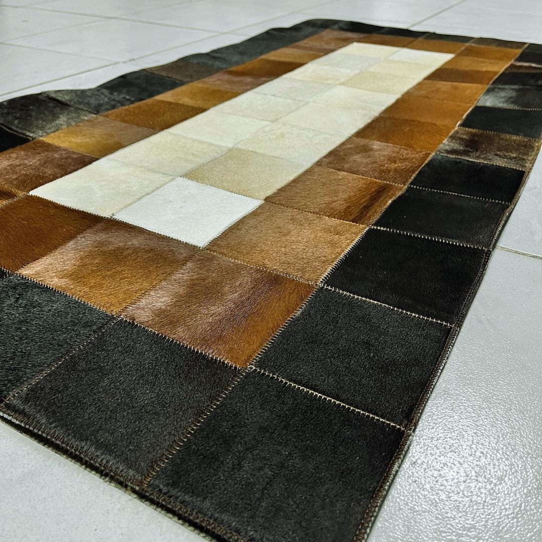 Tricolor Cowhide Patchwork Rug: Handmade Leather Area Rug - BuzzLeatherCarpetTricolor Cowhide Patchwork Rug: Handmade Leather Area Rug