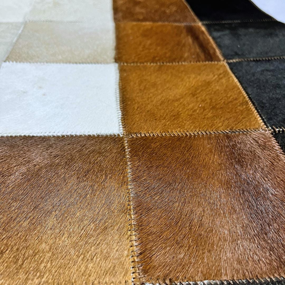 Tricolor Cowhide Patchwork Rug: Handmade Leather Area Rug - BuzzLeatherCarpetTricolor Cowhide Patchwork Rug: Handmade Leather Area Rug