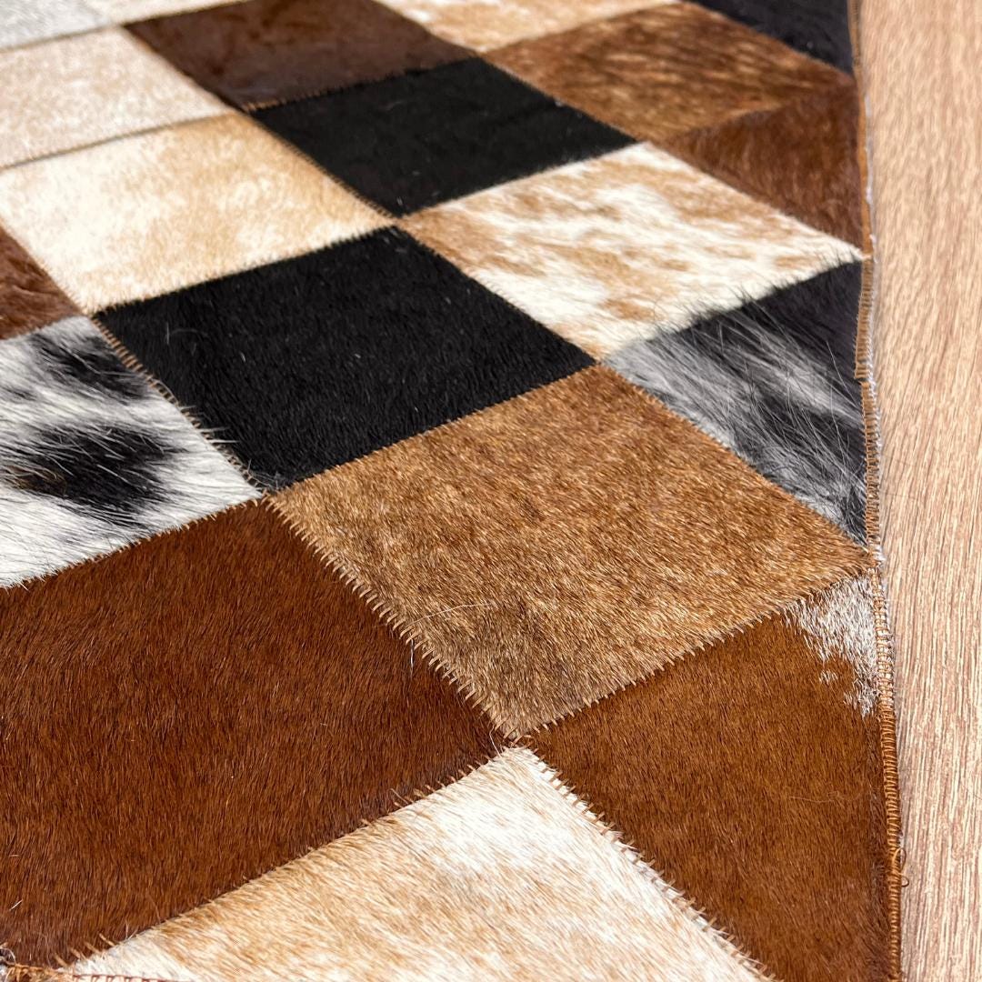 Tricolor Cowhide Patchwork Rug: Rustic Leather Area Rug - BuzzLeatherCarpetTricolor Cowhide Patchwork Rug: Rustic Leather Area Rug