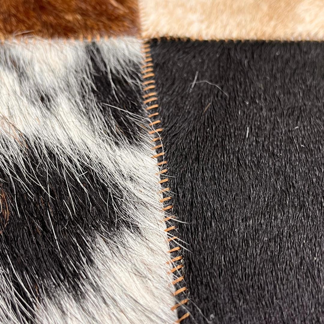 Tricolor Cowhide Patchwork Rug: Rustic Leather Area Rug - BuzzLeatherCarpetTricolor Cowhide Patchwork Rug: Rustic Leather Area Rug